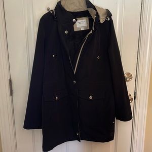 Nautica lightweight hooded coat. Zip up and water repellent. Good is removable.